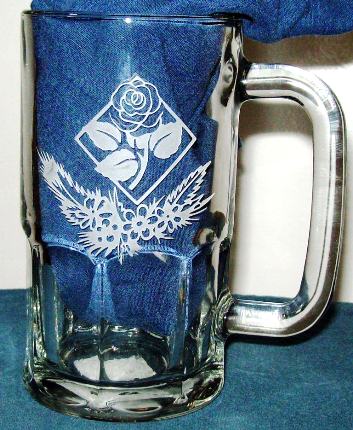 Rose etched in a glass beer mug.
