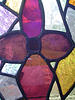 Using acid cream on stained glass for making grooves.