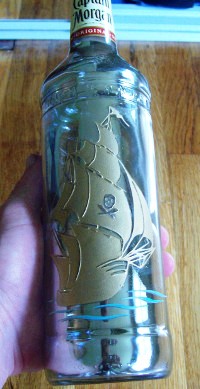 Bottle with mirroring, etching, and paint.