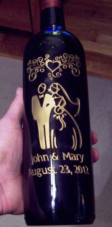 Wedding bottle design etched with gold paint.