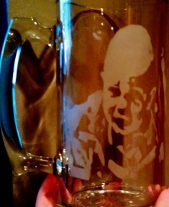 A baby picture etched in a stein.