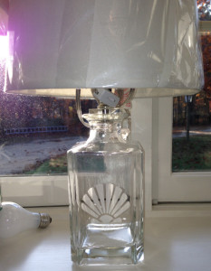 A fillable lamp etched with a shellfish.