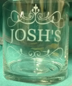 A tumbler glass etched with name.