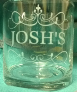 A tumbler glass etched with name.