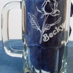 Etched glass beer mug of a flower and name personalized.