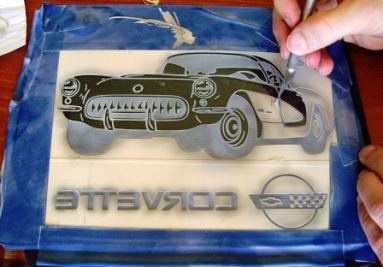 Multi-stage sandcarving a Corvette into plate glass.