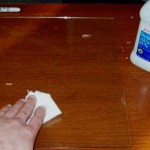 Wiping glass sheet down with rubbing alcohol.