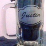 A non reusuable stencil etched glass beer mug.