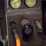 Adjustment gauges on compressor for air pressure settings.