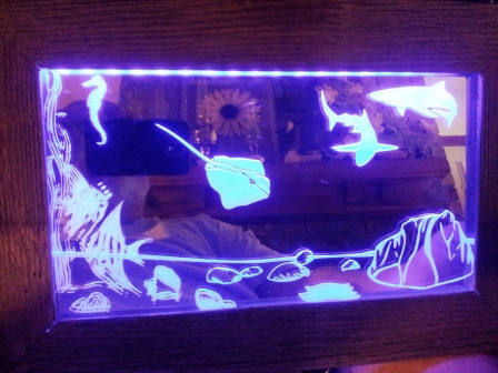 LED mirror etching depicting ocean life.