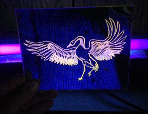 blacklighted etching on glass mirror