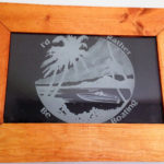 Custom frame etched glass of a boat and beach.