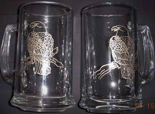 Gold colored etchings on glass mugs. 