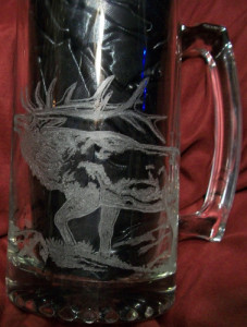An elk rotary engraved on a beer mug by Diane Lee.