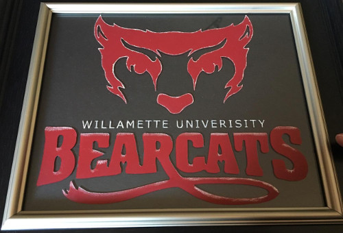 Etched and painted university logo of Willamette University.