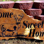 Landscape rock sandblasted with deer and sweet home.