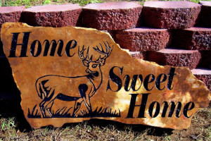 Landscape rock sandblasted with deer and sweet home.
