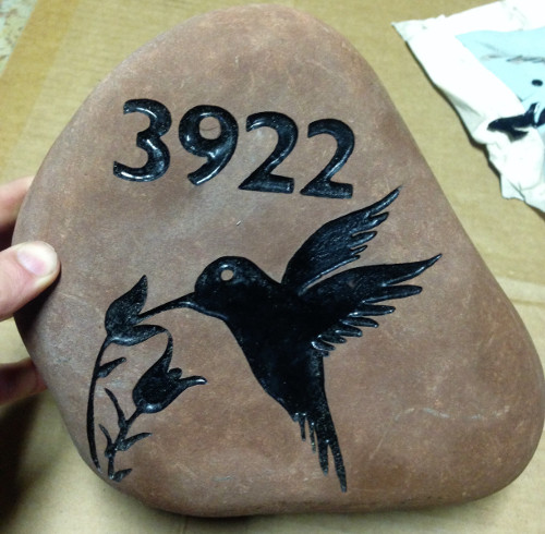 sandblast stone sign with address, flowers and hummingbird.