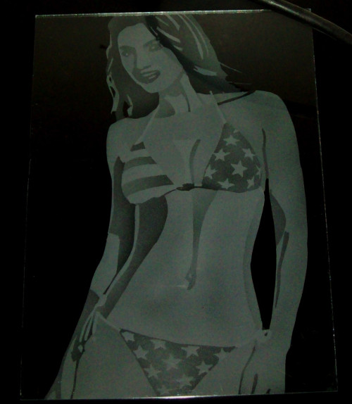Bikini girl shadeblast etched on glass.