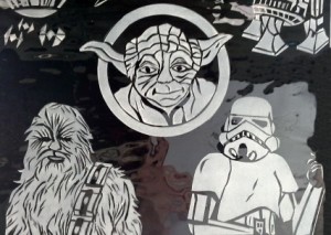 A closer view of the middle portion of the Star Wars glass with Yoda Luke Skywalker and Chewbacca.