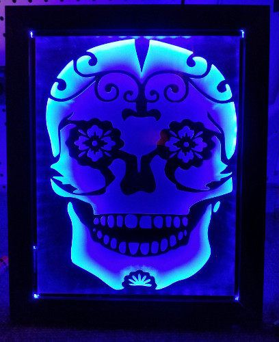 tribal skull sandcarving in led stand.