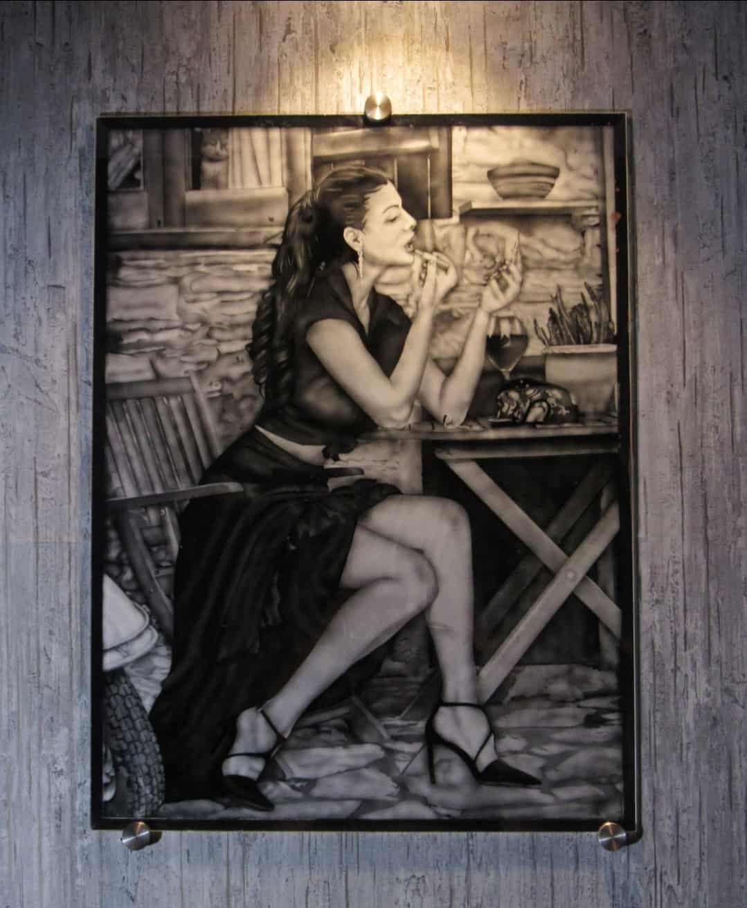 Model etched on glass depicting her in makeup room.